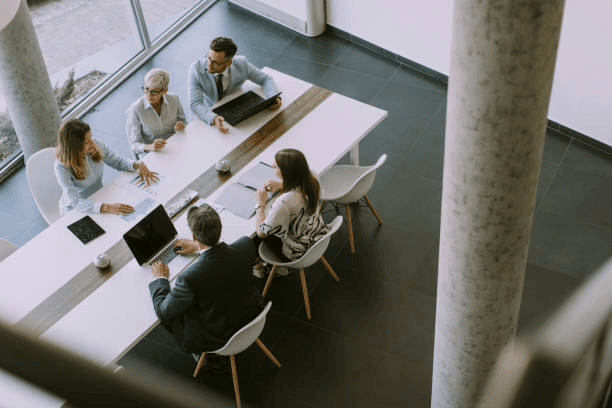 people working at at table